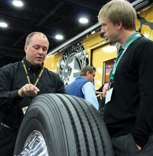 continental truck tire product manager johnny cape explains fuel-efficient tire construction to a show attendee at the 2013 mid-america trucking show.