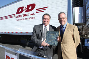 dean sexton, president of d&d sexton (left), accepts the thermo king energy efficiency leader award from martin duffy, vice president of sales and market development for thermo king.
