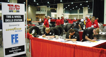 contestants get started at the tire and wheel station.